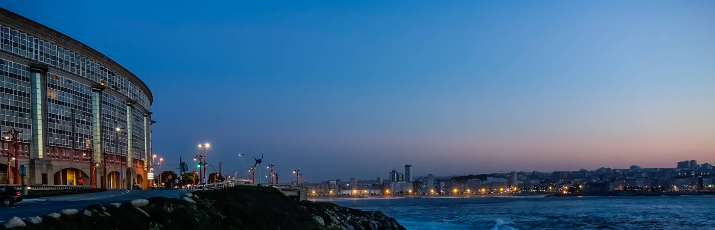 A view of the harbor of A Coruña at dusk.